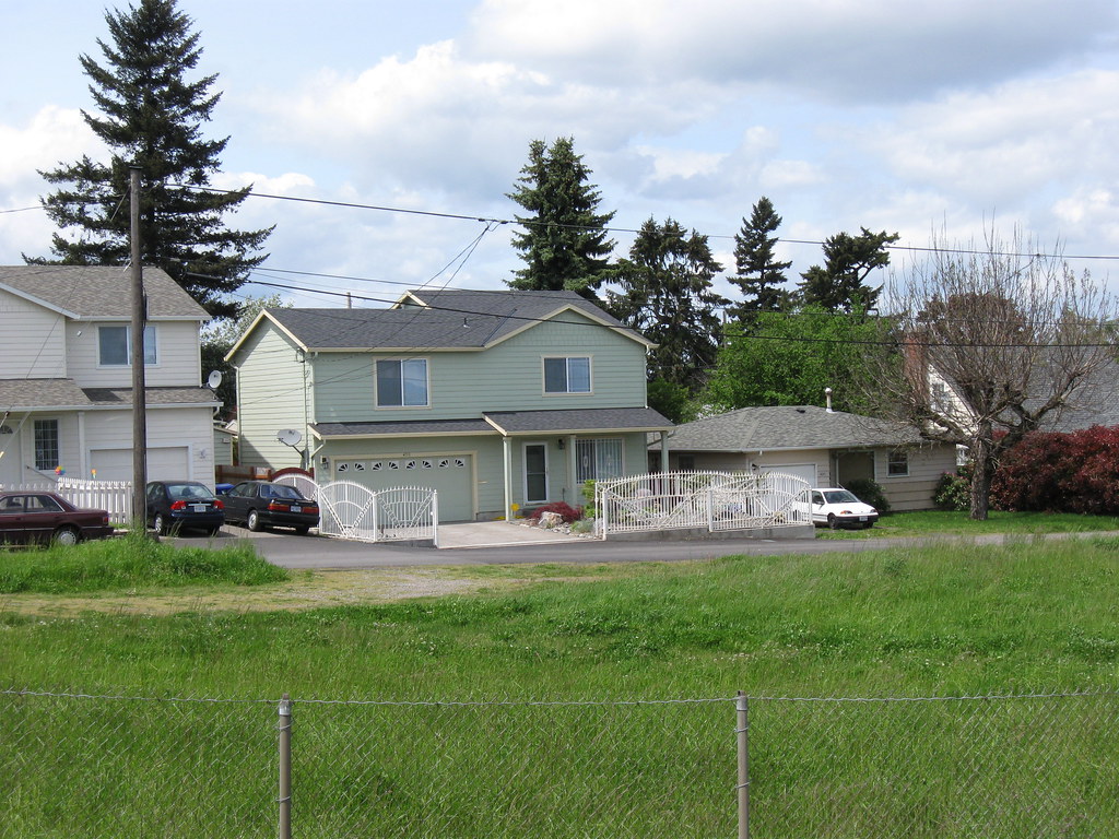 Modest homes on a residential street (watch: The cheaper house costs more)