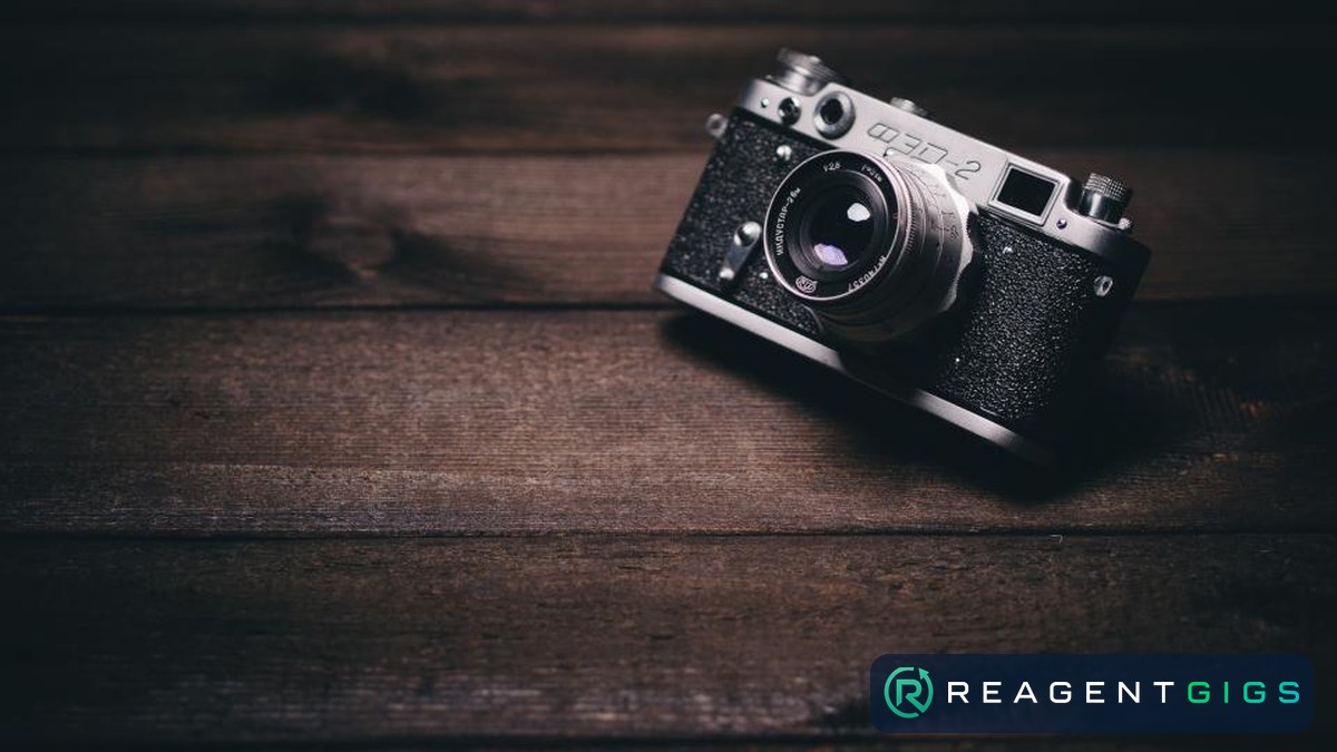 A film camera on a wooden table
